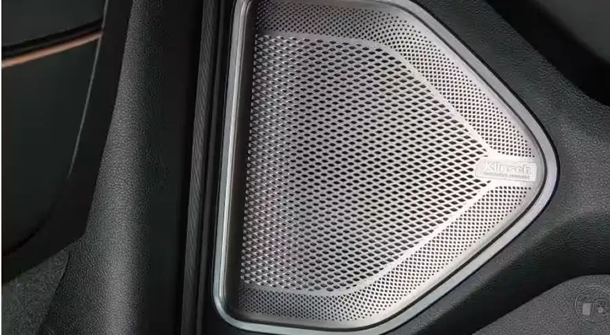 Klipsch Reference Premiere speaker grille set into the door trim of the RAM 1500 Tungsten