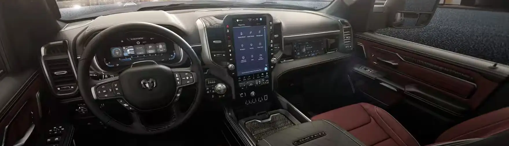 Wide view of the RAM 1500 Tungsten dashboard, steering wheel and burgundy leather seats