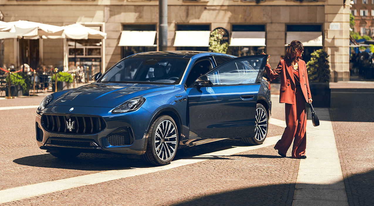 Woman stading by car