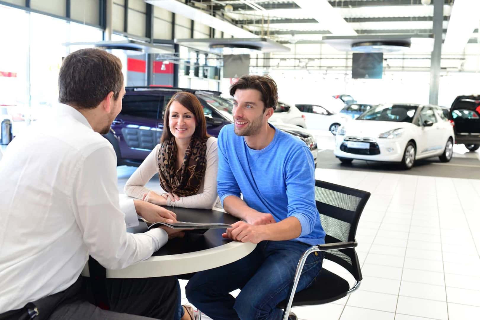 Couple Learning About EV Finance Options