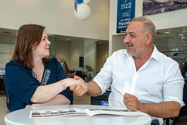 Employee and Customer Shaking Hands