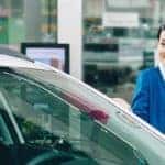 A customer and a sales team member looking at a new Hyundai
