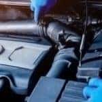Service tech working on a Hyundai Engine