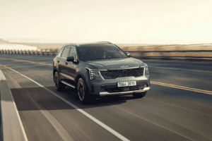 2025 grey kia sorrento driving on road with blurred background