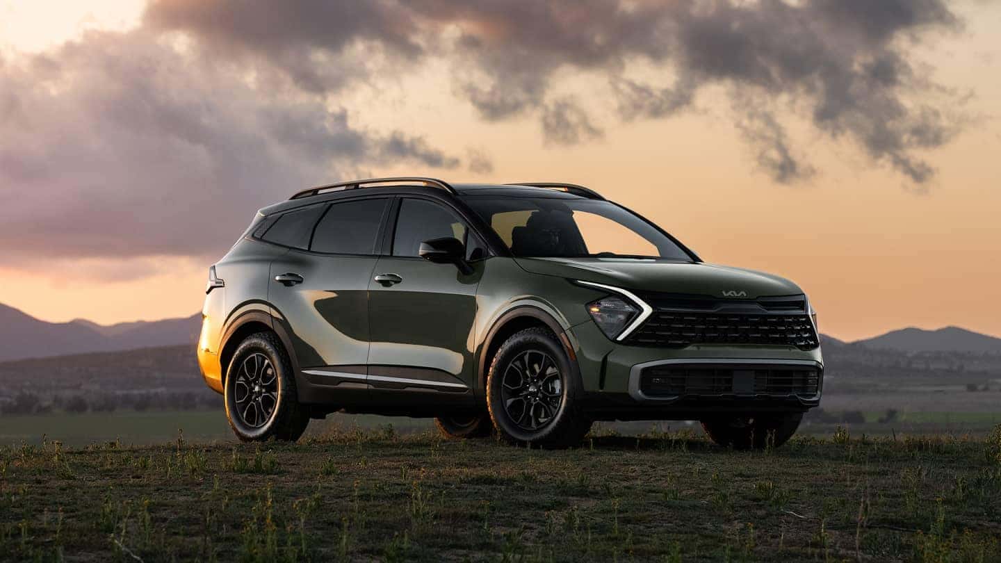 2025 Kia Sportage in field during sunset 