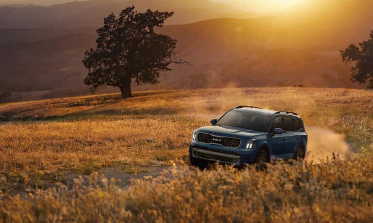 2025 Kia Telluride driving in a field