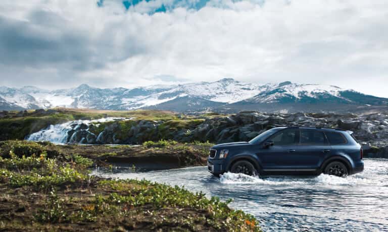 2025 Kia Telluride driving in a stream
