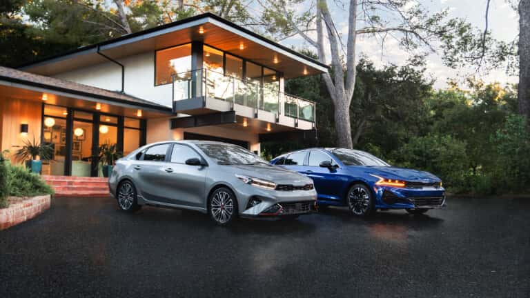 2026 Kia K5 pair parked outside a house