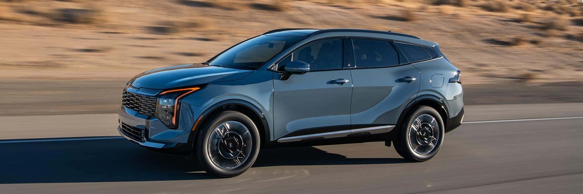 kia sportage hybrid driving on road
