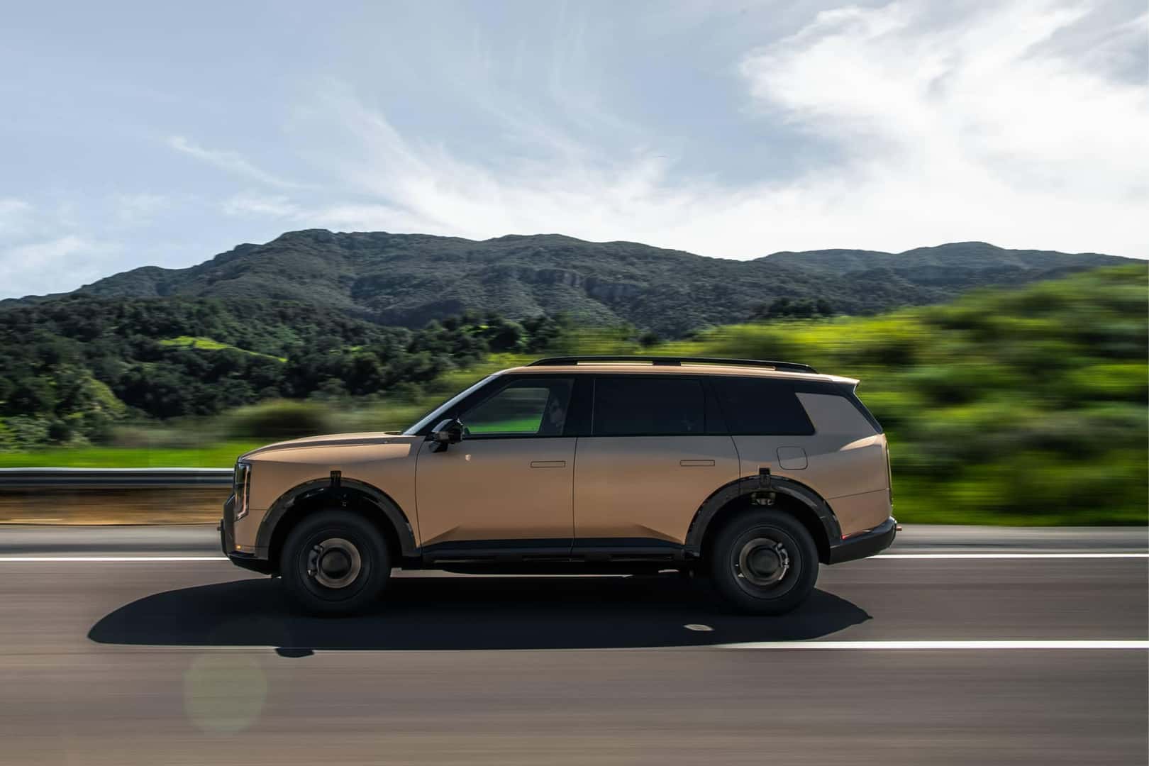2026 kia telluride driving in front of mountains