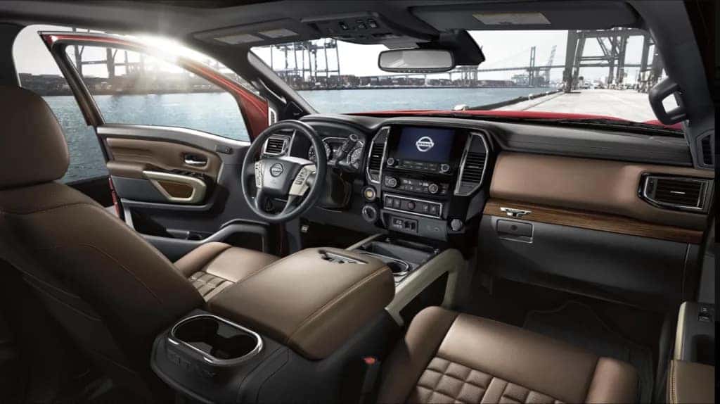 Interior view of a Nissan SUV highlighting technology, comfort, and spacious seating