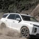 white hyundai suv on dirt