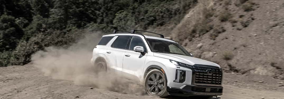 white hyundai suv on dirt