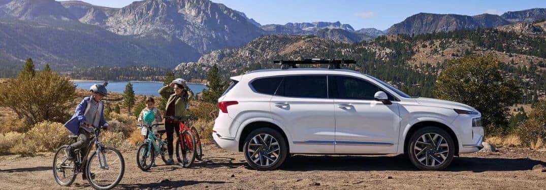 family outside hyundai suv