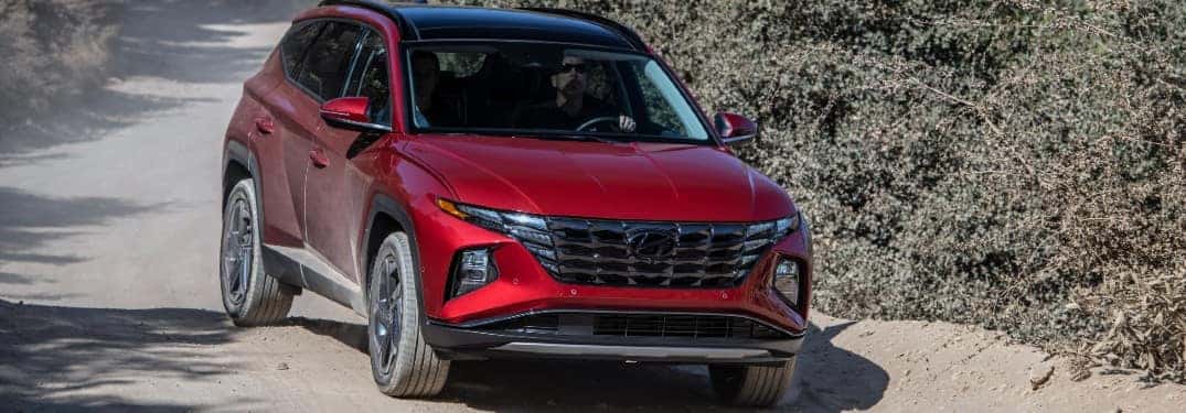red hyundai on trail