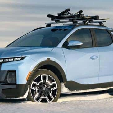 Blue Hyundai Santa Cruz in Snow