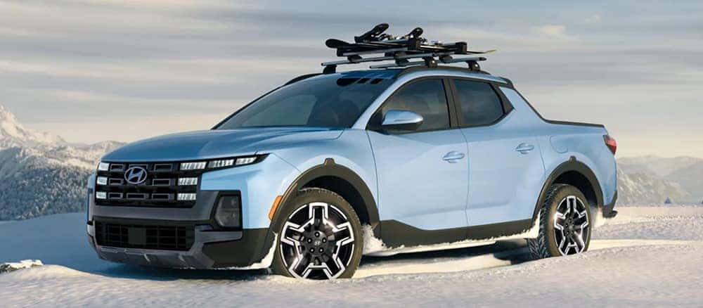 Blue Hyundai Santa Cruz in Snow