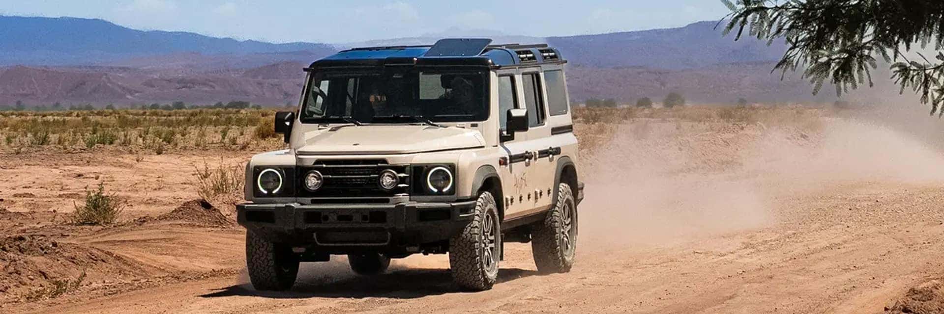 ineos driving down a desert road