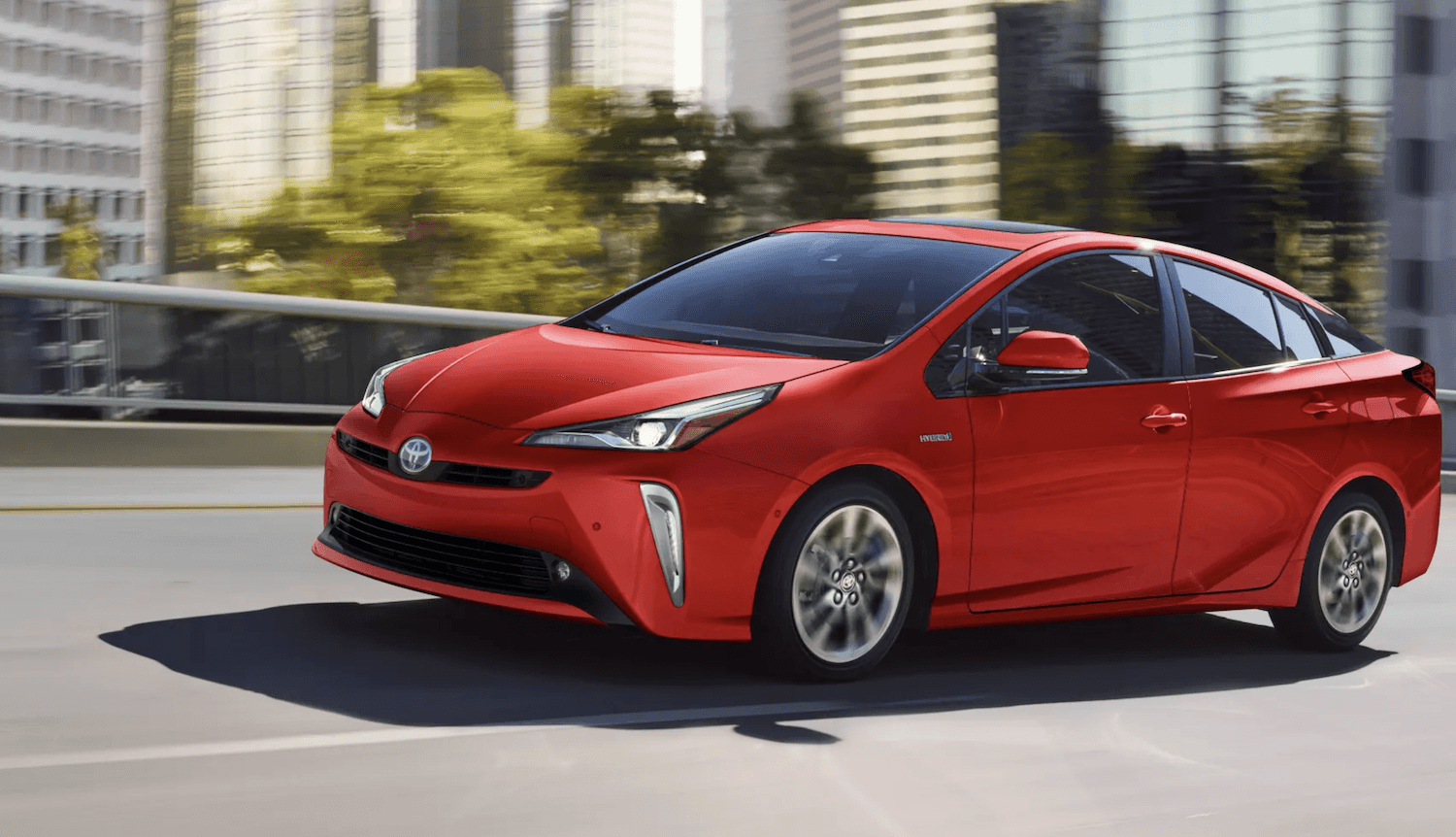 Red 2022 Toyota Prius on highway