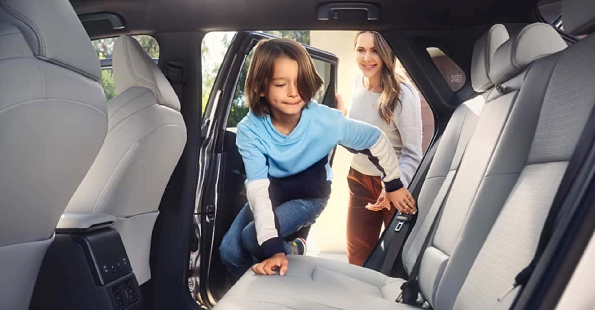 Child getting into Toyota bz4x