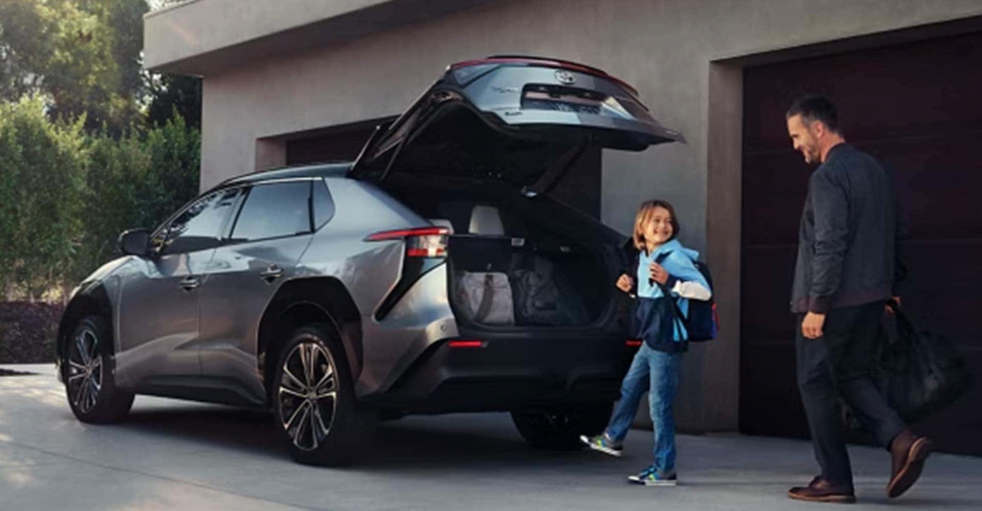 Child using trunk activator on Toyota bz4x