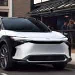 Side-view-of-woman-walking-on-the-side-of-Toyota-bz4x