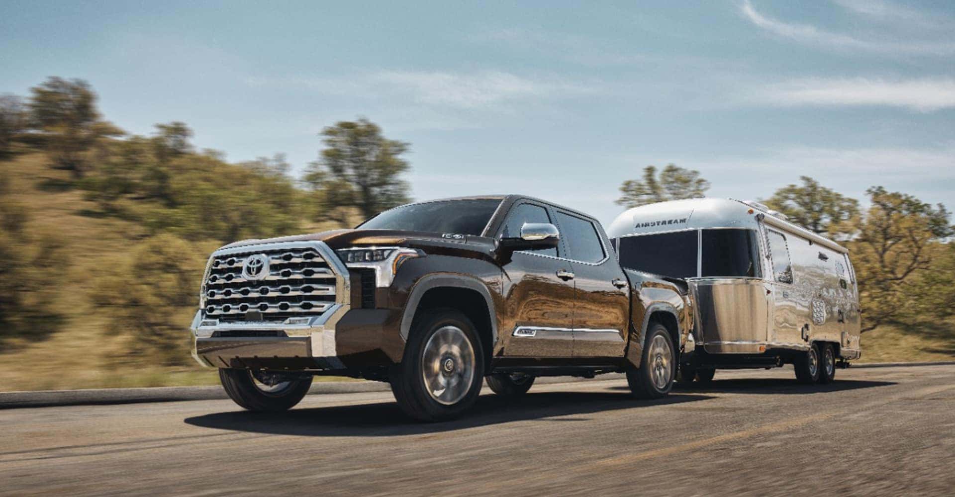 side view of black tundra carrying trailer