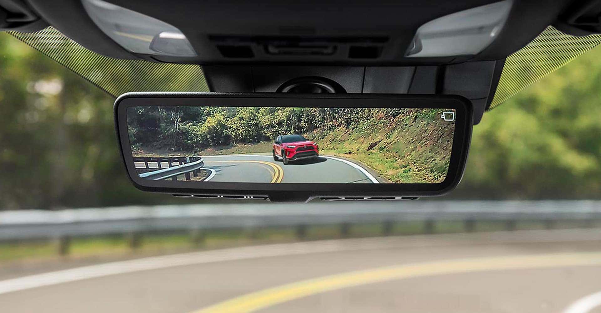 view of rav4 through rearview mirror