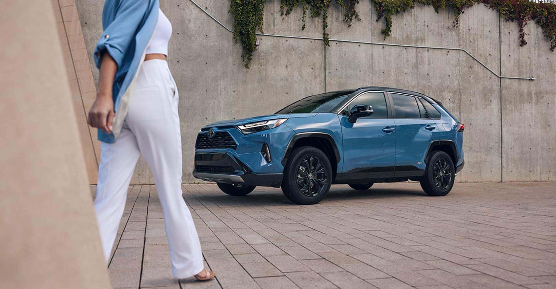 woman walking by rav4