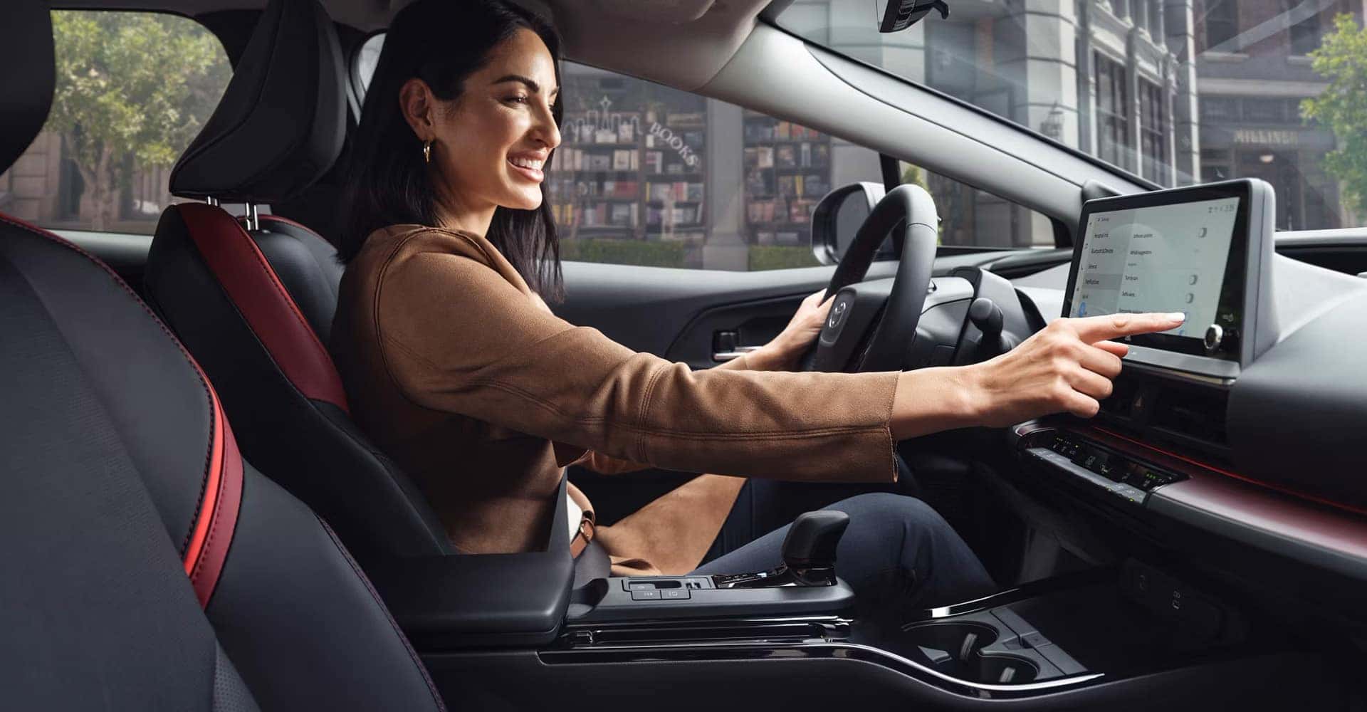 Woman-using-touchscreen-2025-Prius-Prime