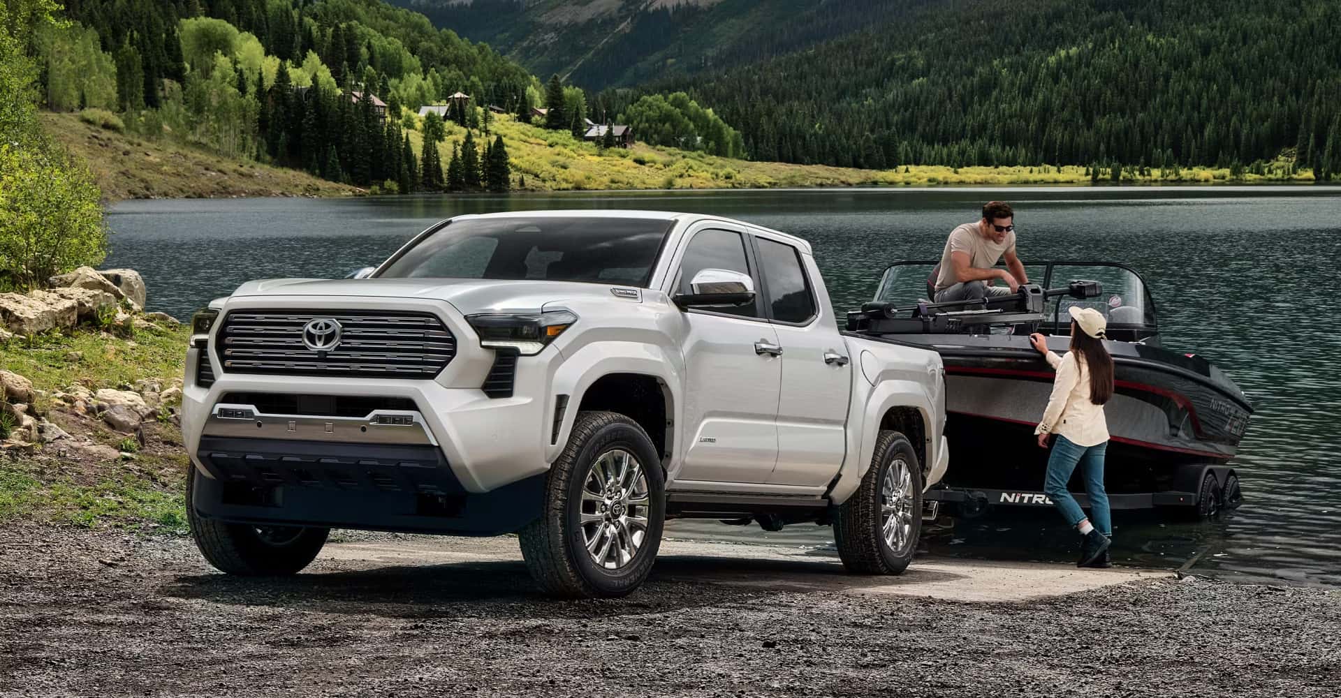 Couple unloading boat from their 2025 toyota tacoma