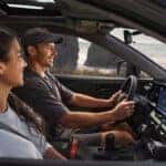 People in front seats of 2026 Toyota RAV4 hybrid