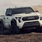 2026 Toyota Tacoma dirivng through mud and dirt
