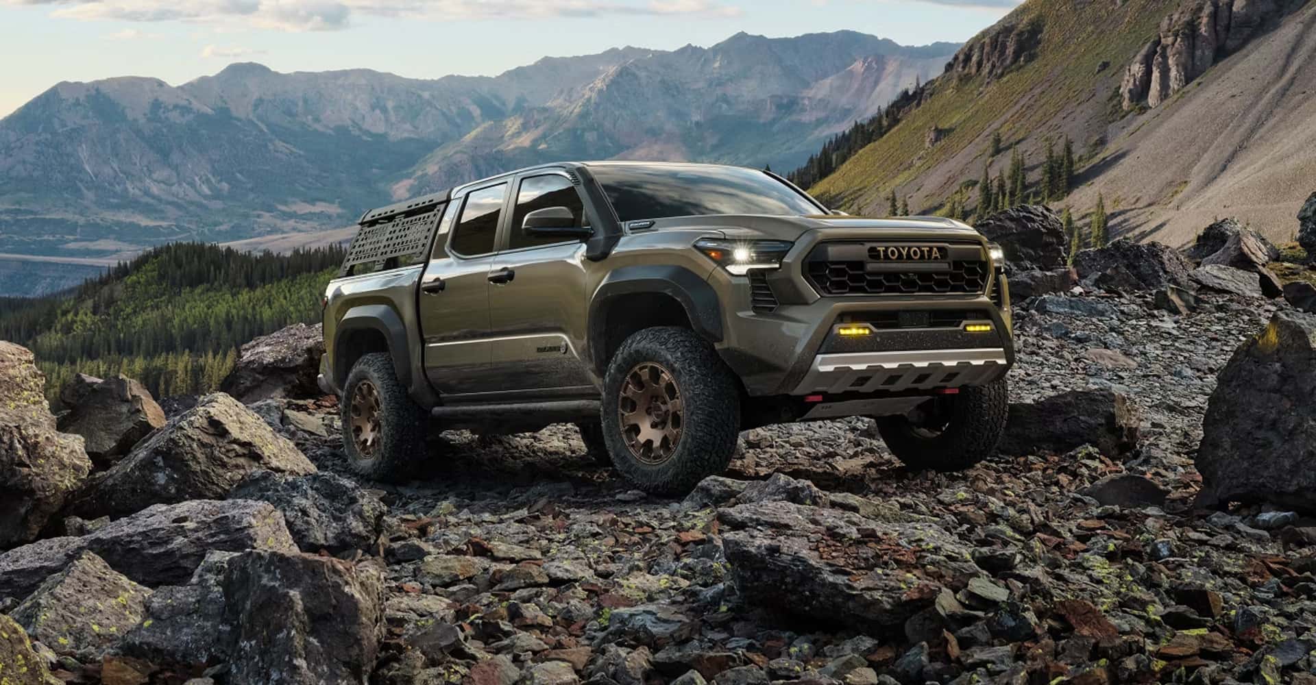 2026 Toyota Tacoma driving up rocks