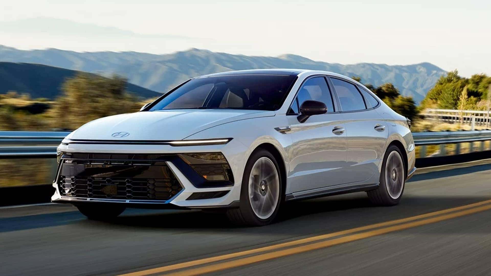 white 2026 hyundai sonata driving on road
