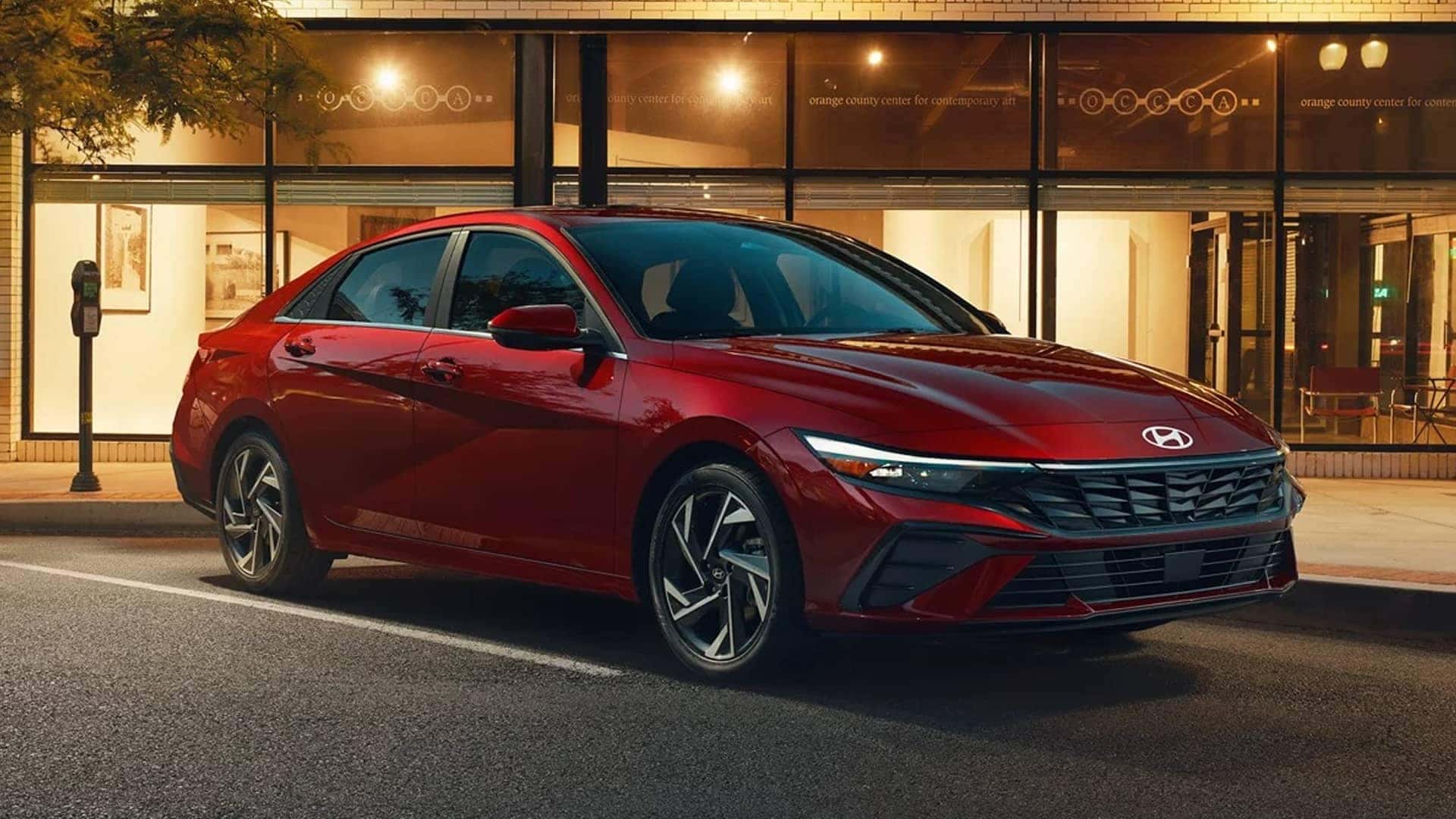 red 2026 hyundai elantra parked in front of building