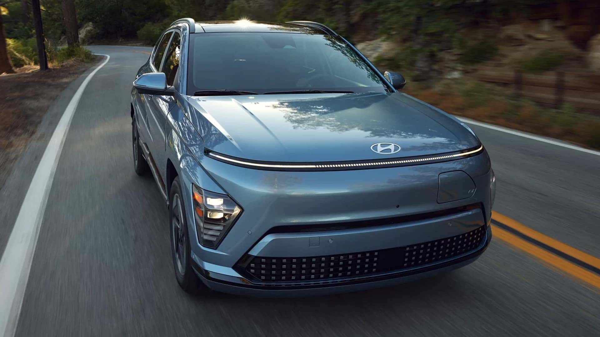 2025 Hyundai Kona Electric Driving Down the Road