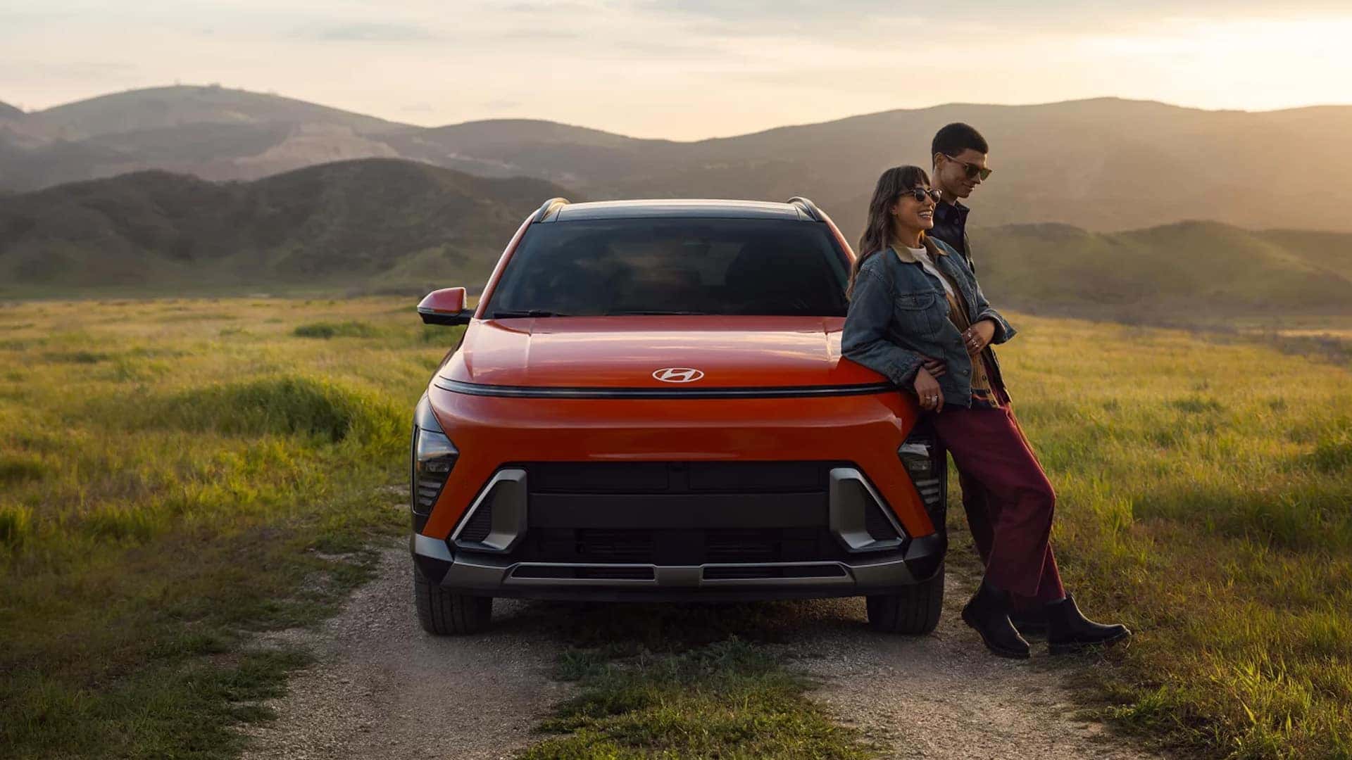 Couple Leaning on Front of 2025 Kona