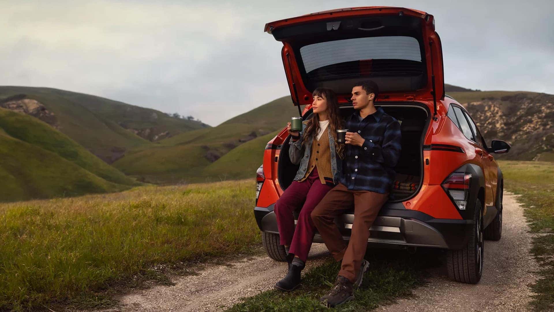 People Leaning on Trunk of 2025 Kona