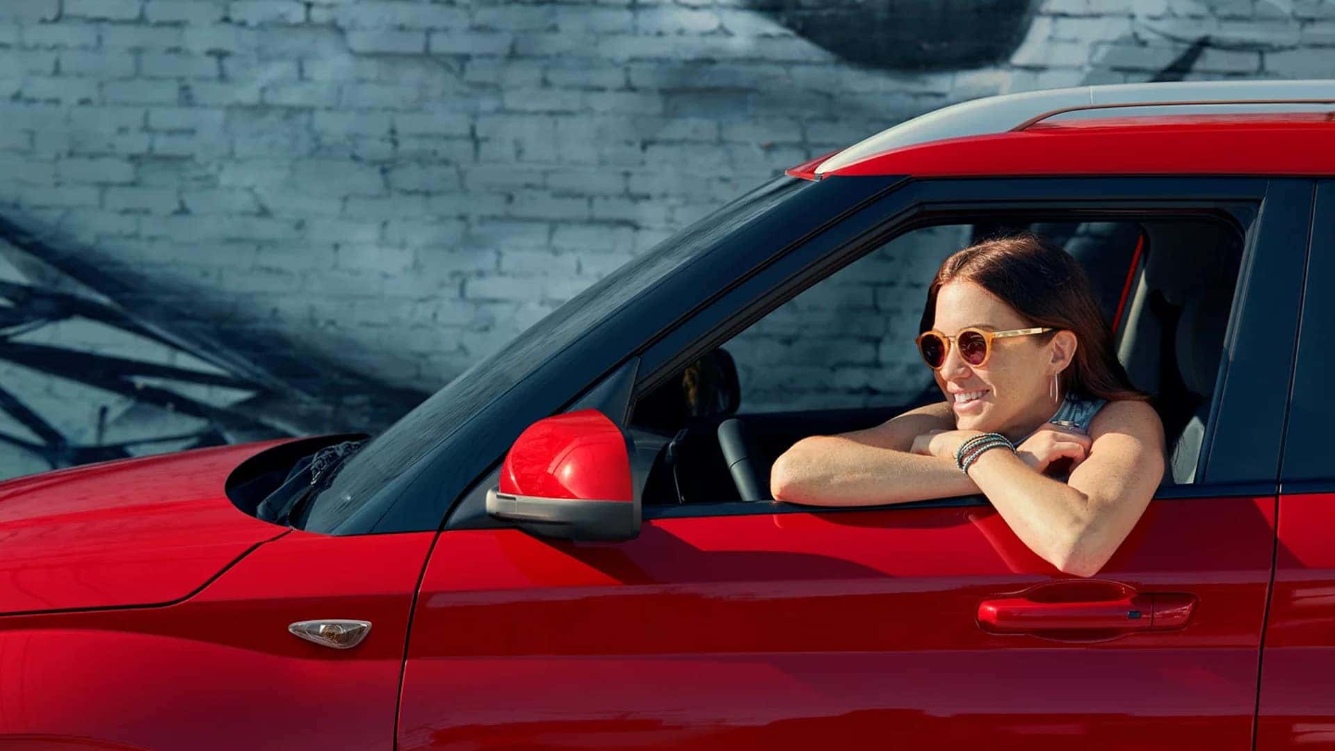 Smiling Woman Leaning Out of 2025 Hyundai Venue Window