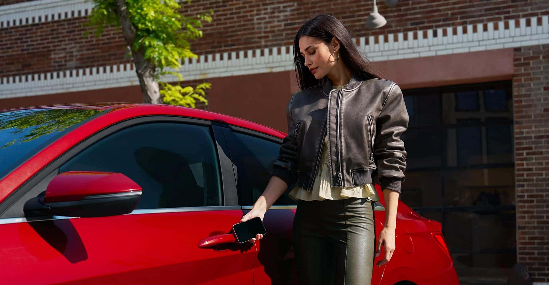 Woman pulling on 2025 Hyundai Elantra handle