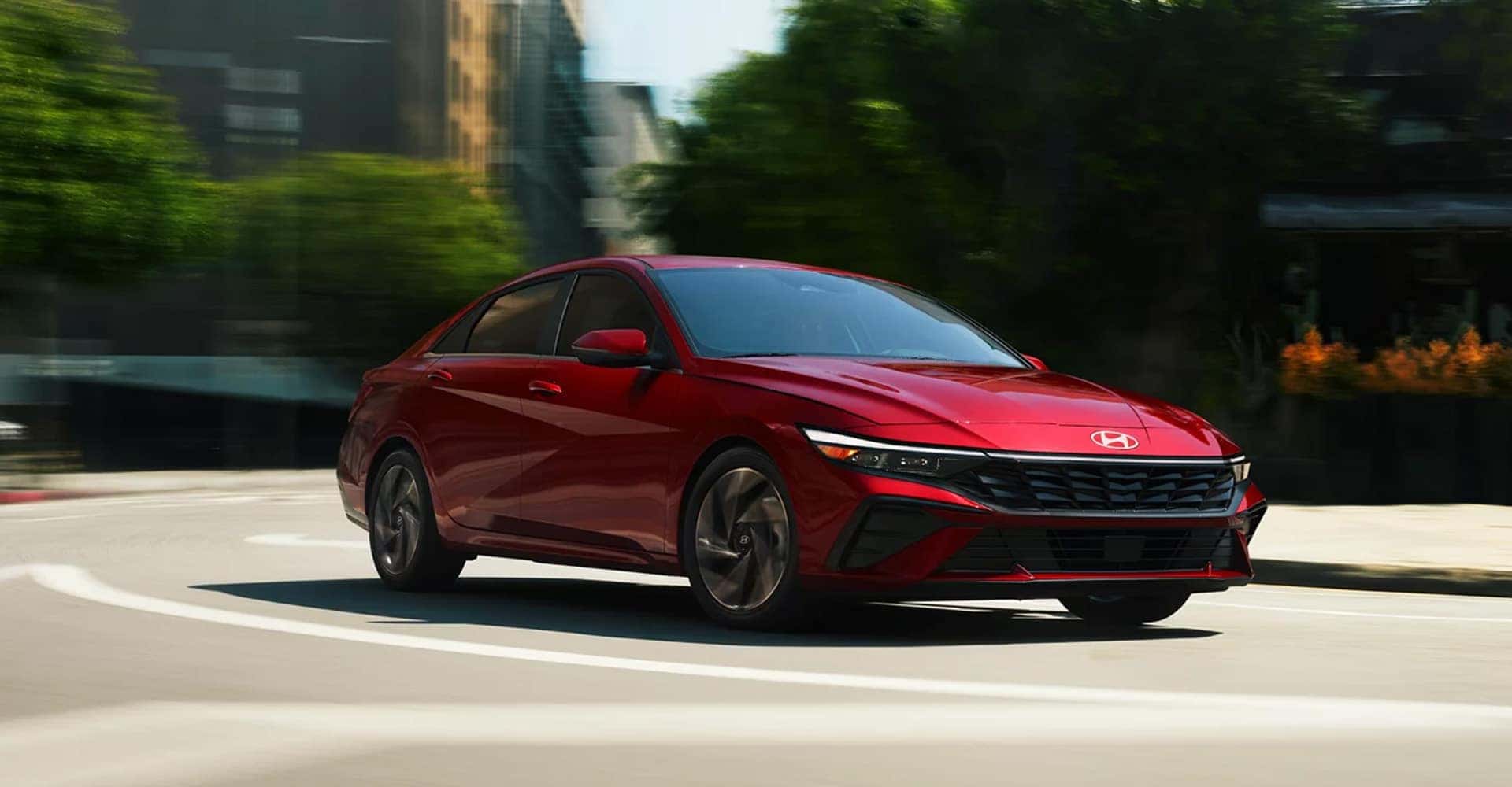 Hyundai-Elantra-red-side-driving