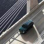 2026 Hyundai Palisade Hybrid driving on bridge