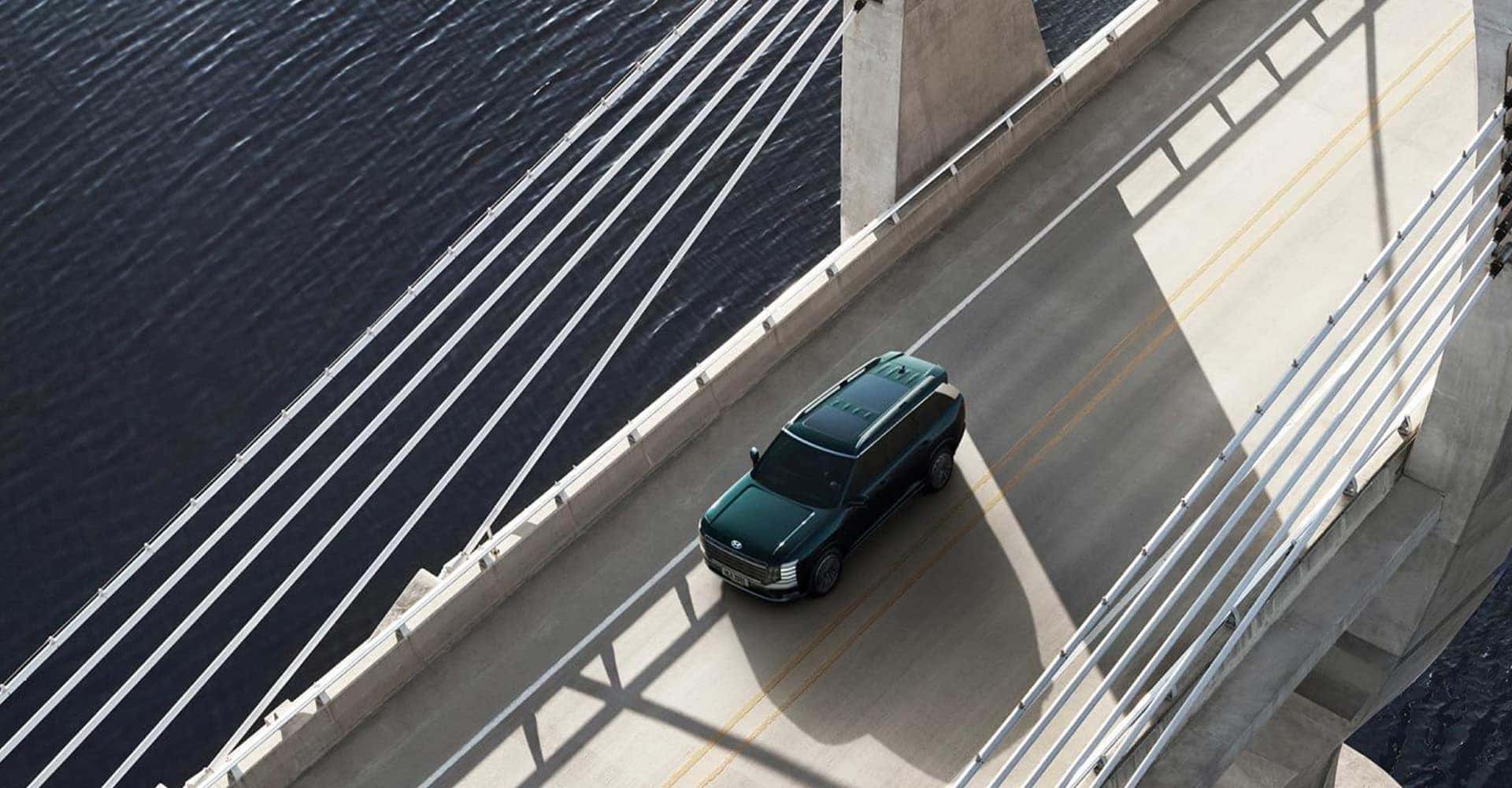 2026 Hyundai Palisade Hybrid driving on bridge