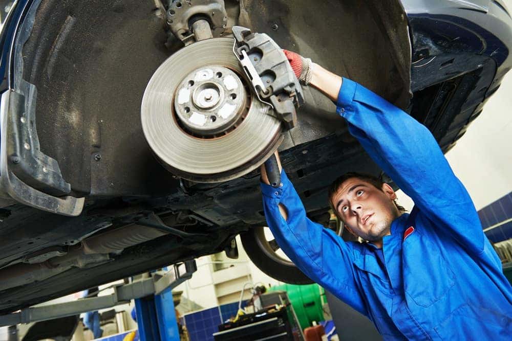 Buick GMC Tech Working on the Brakes
