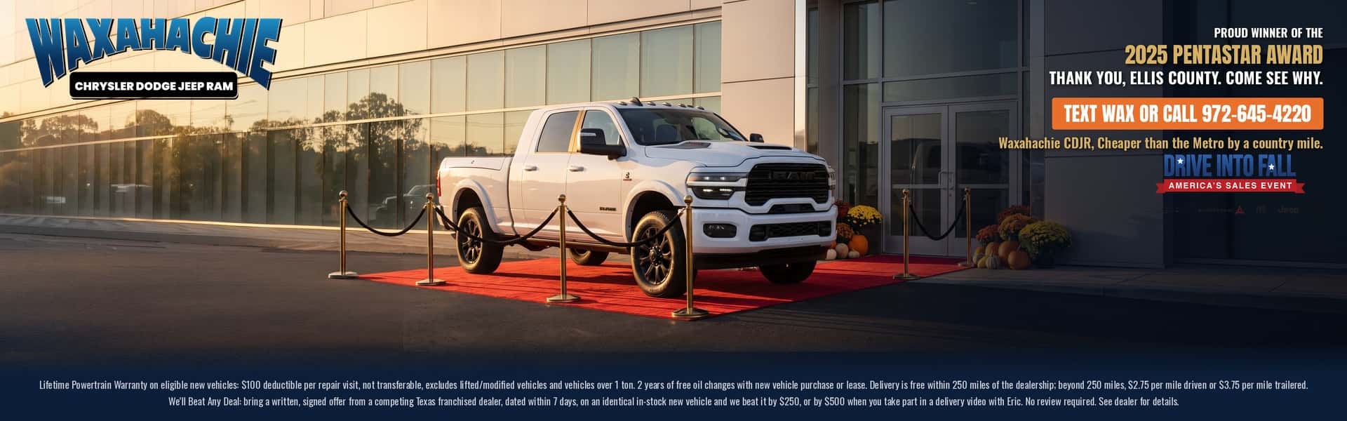 White Ram truck on a red carpet outside Waxahachie Chrysler Dodge Jeep Ram, celebrating the 2025 Pentastar Award. Text WAX or call 972-645-4220